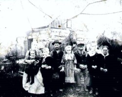 John & Susan Baker & family before log cabin home