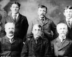 Smith men, c 1897. Back center: William Andrew Smith b. 1850, Reach Twp, ON. Back right: Charles Lesley Smith (Williams' son) b. 1880, Standish. Back left: Possibly be Homer Smith, Charles' cousin. | Contributed by Judy Addison Smith men, c 1897