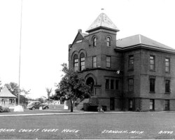 Old Arenac Co courthouse postcard. 3rd county courthouse but 1st one in Standish built 1892 of "Richardsonian Romanesque" design. Demolish c 1965 to build the 4th courthouse (2nd in Standish), Gerganoff of Ypsilanti, architect; date unknown | Contributed by Robert Kosick