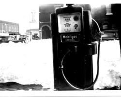 Standish winter scene of town beyond Mobilgas Special blend gasoline pump (probably at Fletchers); date unknown | Contributed by Robert Kosick